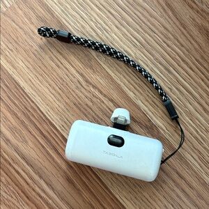 Tazgila White Portable Device with Black Strap